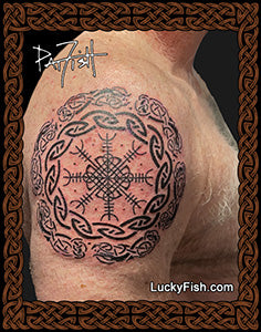 Nordic Celtic tattoo on a man's shoulder arm with Luckyfish.com branding