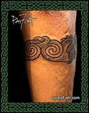 back view of spirals in double dragon armband tattoo
