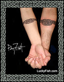 matching tattoos of welsh heart on couple forearms 