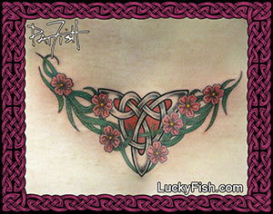 Tattoo design of a Celtic knot with flowers on a woman's lower back, with LuckyFish.com branding