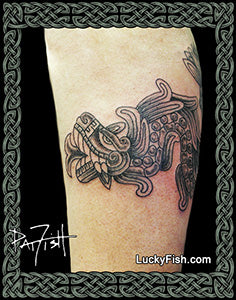 Tattoo of a Mexican quetzalcoatyl design on a person's arm with 'Lucky Fish' branding.