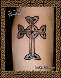 A black and gray Celtic cross tattoo design shown on skin, framed by a decorative brown and gold Celtic knot border. A signature reading 'Pat Fish' appears in the upper left, and 'LuckyFish.