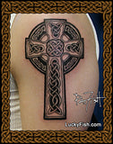 Celtic cross tattoo on skin by Pat Fish with signature and website link to luckyfish.com