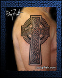 Celtic cross tattoo on a person's shoulder with 'Lucky Fish' branding.