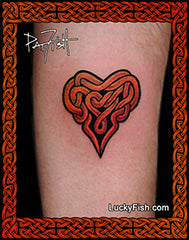 Tattoo of a red Celtic knot heart design on skin with  'Lucky Fish' branding.