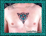 Person with a Celtic knot tattoo on chest, dedication tattoo by Pat Fish