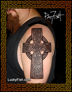 Man with a large Celtic cross tattoo on his shoulder, with 'LuckyFish.com' branding.