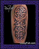 Tattoo design of a Celtic knot by Pat Fish on an upper arm with 'Lucky Fish' branding.