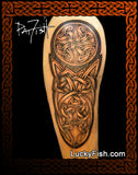 Tattoo design of a half sleeve Celtic knot on an upper arm with 'Lucky Fish' branding.