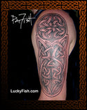 Celtic knot tattoo on an upper arm half sleeve tattoo with 'LuckyFish.com' branding.