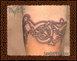 Celtic knot tattoo of cats from the Book of Kells manuscript on skin with Lucky Fish branding and Pat Fish signature