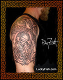 Tattoo of a Celtic design of animals on a person's arm with 'Lucky Fish' branding.