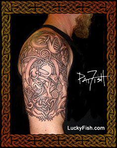 Tattoo of a Celtic design of animals on a person's arm with 'Lucky Fish' branding.