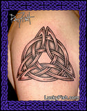 Celtic knot tattoo on a person's arm with 'Lucky Fish' branding.