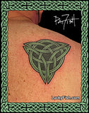 Green Celtic knot tattoo on skin by Pat Fish with 'Lucky Fish' branding.