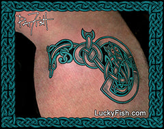 Tattoo of a Celtic knot design of eels and snakes on skin with Lucky Fish branding.