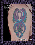 Tattoo of a colorful Celtic knot design of two sea horseson a person's arm, with 'Lucky Fish' branding.