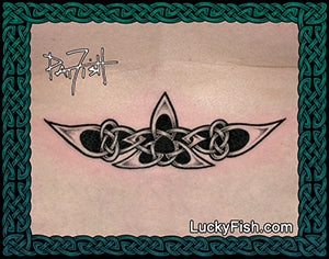 Tattoo design of a triskle with Celtic knotwork on a lower back, featuring the LuckyFish logo branding