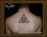Person with a Celtic knot tattoo on their back by Pat Fish