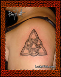 Triquetra tattoo on a shoulder with 'Lucky Fish' branding.