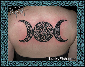 Tattoo of a Celtic triple moon symbol on a person's back with 'Lucky Fish' branding.