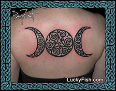 Tattoo of a Celtic triple moon symbol on a person's back with 'Lucky Fish' branding.