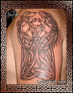 Celtic knot tattoo on a person's arm with Celtic dog and Celtic dragon and 'LuckyFish.com' branding.