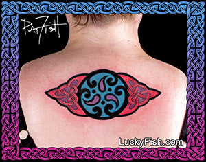 Tattoo of a colorful Celtic design on a woman's back with 'Lucky Fish' branding.