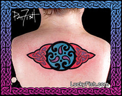 Tattoo of a colorful Celtic design on a woman's back with 'Lucky Fish' branding.