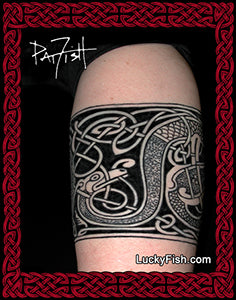 Celtic dog tattoo on a person's arm with 'Lucky Fish' branding.