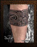 Tattoo design on a person's leg with Celtic dog in knotwork by Pat Fish