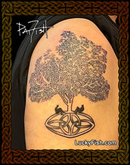 photo of tattoo of tree with Celtic roots and LuckyFish branding