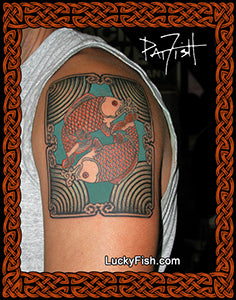 Tattoo of  two fish on shoulder with 'Lucky Fish' branding.