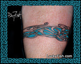 Tattoo of a Viking dragon design on a person's arm with 'Lucky Fish' branding.