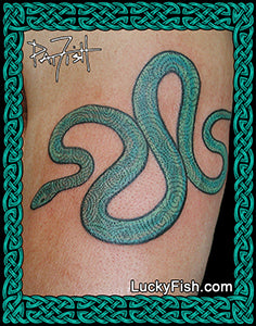 Tattoo of a green snake design on skin with spirals from Newgrange with Lucky Fish branding.