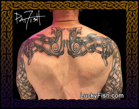 Tattoo design on a person's back with Nordic Viking wolves and featuring the brand 'Lucky Fish.com'.
