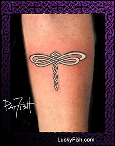 Tattoo of a dragonfly design on a person's arm with luckyFsh branding