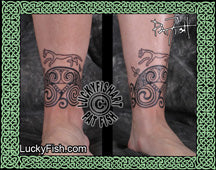 Tattoos on a person's leg with intricate Celtic and Pictish designs, featuring the brand 'Lucky Fish'.