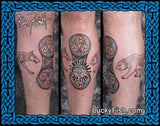 Three tattoos on a leg calf with intricate designs, featuring a Pictish double disc flanked by wolf and bear, with 'Lucky Fish' branding.