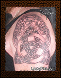 Celtic knot tattoo on a person's shoulder with LuckyFish.com logo.