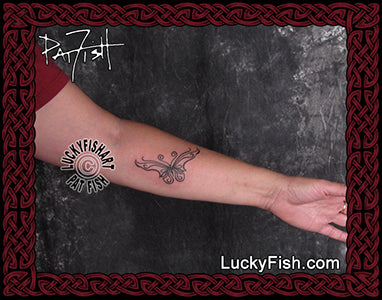 Dynamic Tribal Black Butterfly Tattoo Design